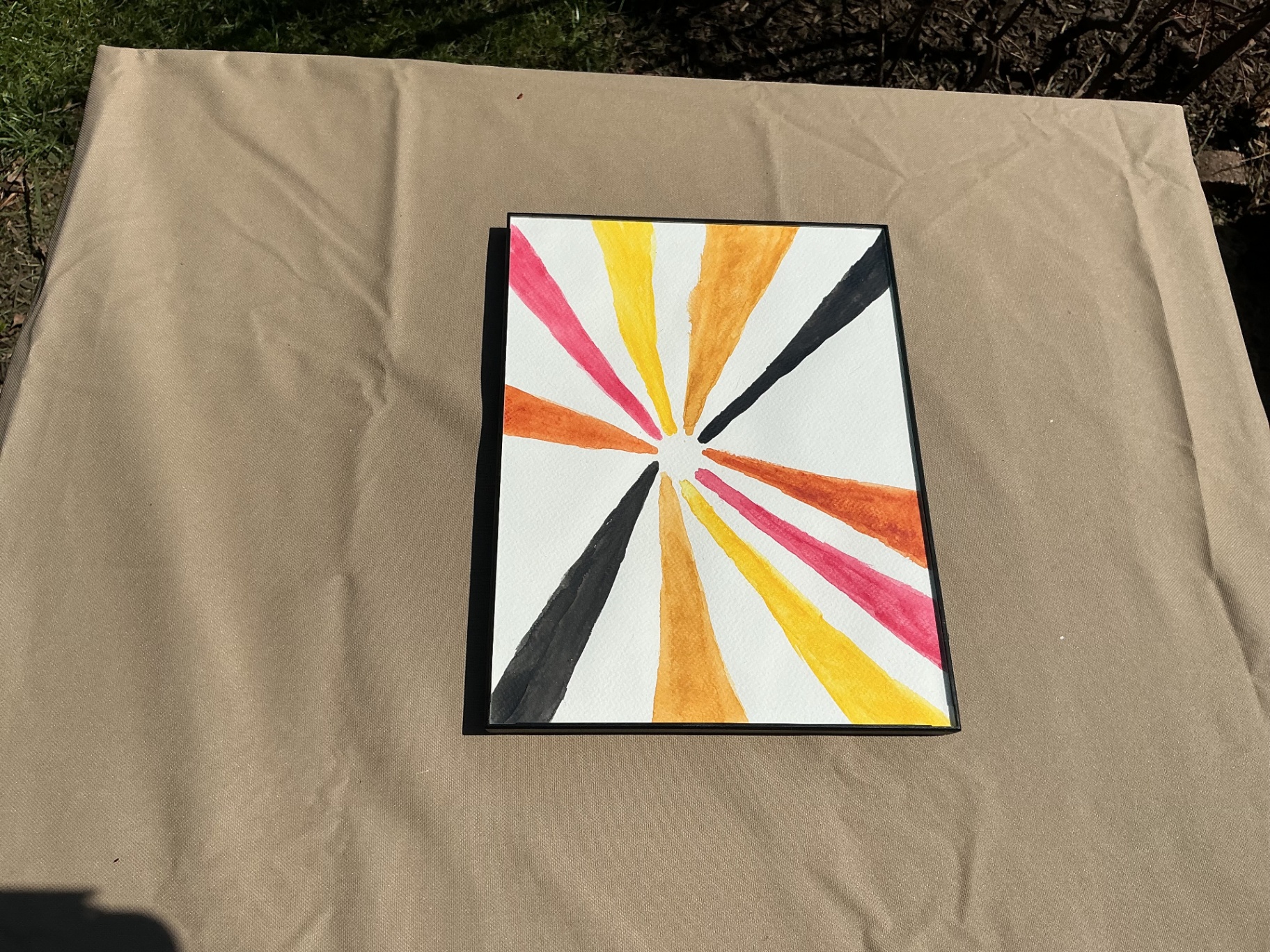 Radial bursts of orange, yellow, pink and black converging to a central point