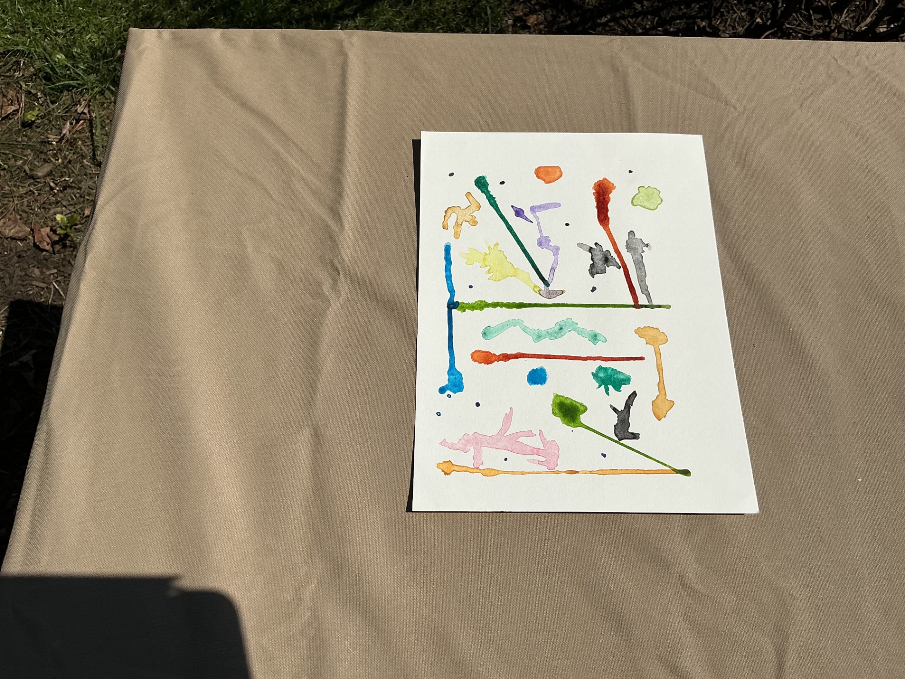 Abstract composition of coloured watercolour drips and short lines on white
