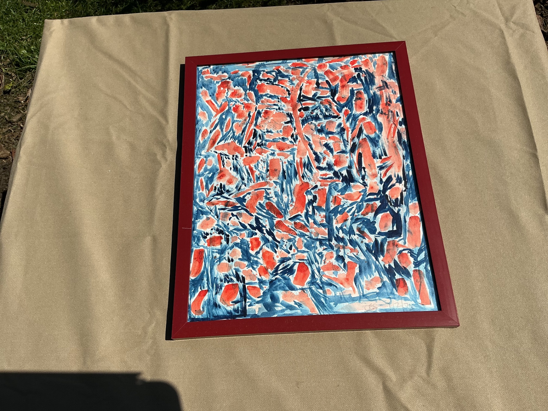 Coral and indigo brushmarks forming a dense abstract weave