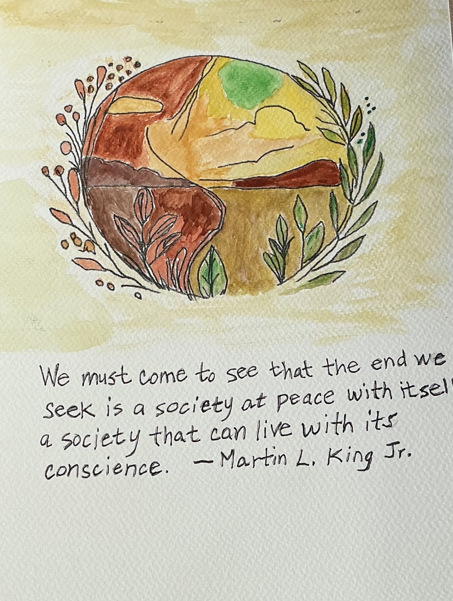 Watercolour of an earth-toned globe wreathed in botanicals with a Martin Luther King Jr. quote