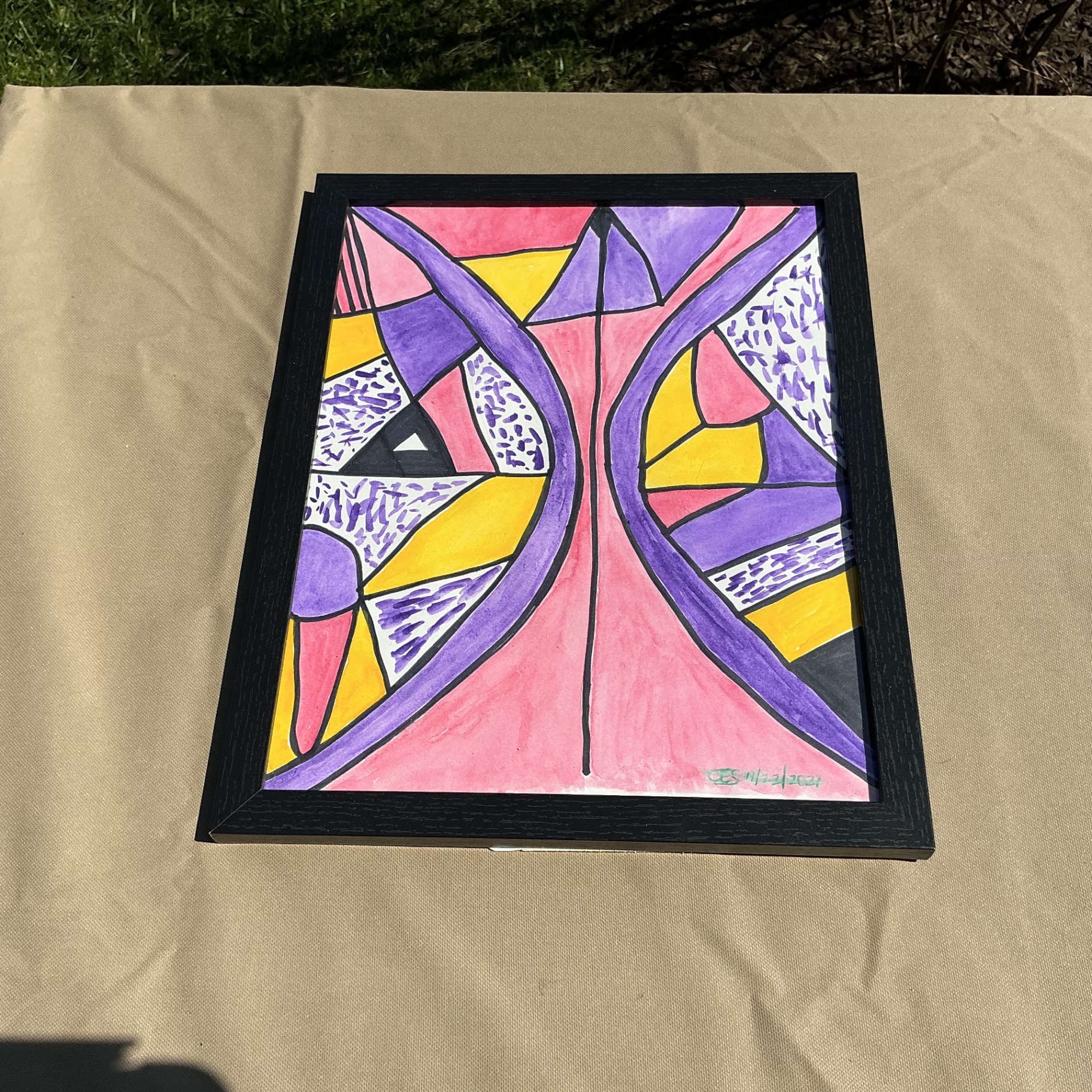 Symmetrical abstract of purple, pink and yellow shapes outlined in black