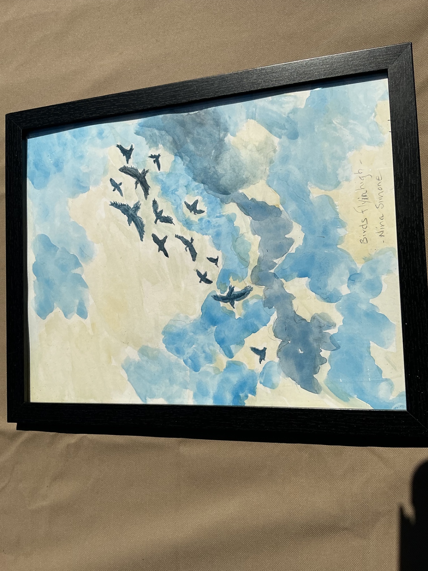 Watercolour of birds flying against a cloud-filled blue sky, after Nina Simone